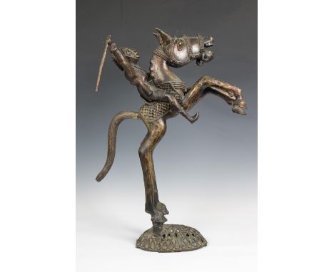 A West African Benin bronze warrior on horseback, the warrior and spear detachable, 68cm. high.