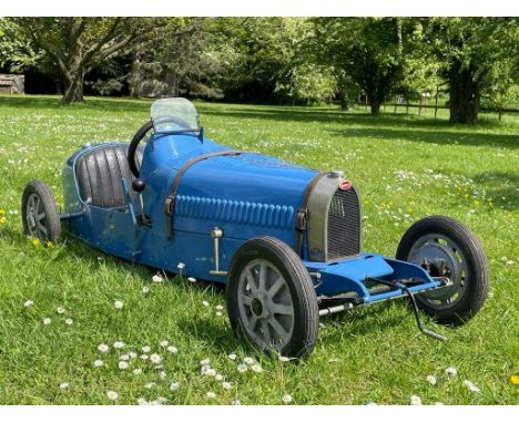 Scarce child's electric-powered Bugatti Type 52 replica racing car. This excellent reproduction of the iconic pre-war Bugatti