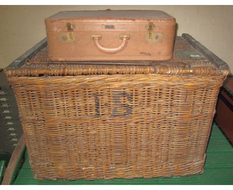 Large wicker travelling hamper or trunk with rope handles and metal lock bar, together with a small vintage over-night suitca