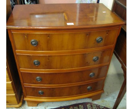 Reproduction Georgian style yew bow fronted chest of four drawers on bracket feet.(B.P. 24% incl. VAT)