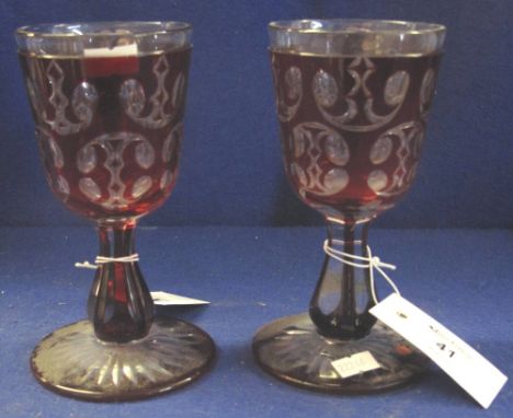 Pair of ruby, flash cut, pedestal goblets, Bohemian. (2)(B.P. 24% incl. VAT)
