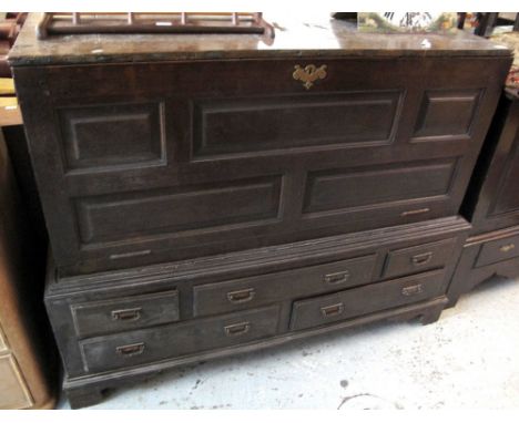 18th Century oak mule chest having an arrangement of five fielded panels and fitted drawers on bracket feet.(B.P. 24% incl. V