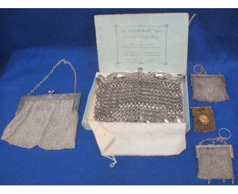 A vintage small silver mesh/chainmail purse and another silver plated one. Two silver plated chainmail handbags one in origin