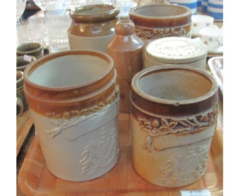 Three two-tone, salt glazed jars with relief armorials, together with an R. White, London, stoneware bottle, stoneware utensi