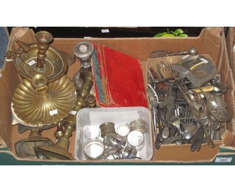 Tray of assorted metalware to include: various loose plated cutlery; pewter hip flask; brass chamber sticks; other candlestic