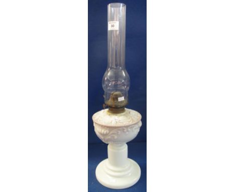 Early 20th Century single burner oil lamp with opaline glass reservoir and pedestal base, clear chimney.(B.P. 24% incl. VAT)