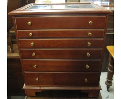 Reproduction mahogany finish six drawer collector's cabinet with glazed display top, on bracket feet.(B.P. 24% incl. VAT)