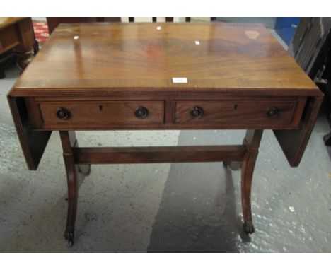 Reproduction Regency style mahogany sofa table on brass claw feet and casters.(B.P. 24% incl. VAT)