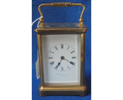 Early 20th Century French gilt brass carriage clock with full depth Roman enamel face, marked: Thomas and Son, Ilfracombe, st