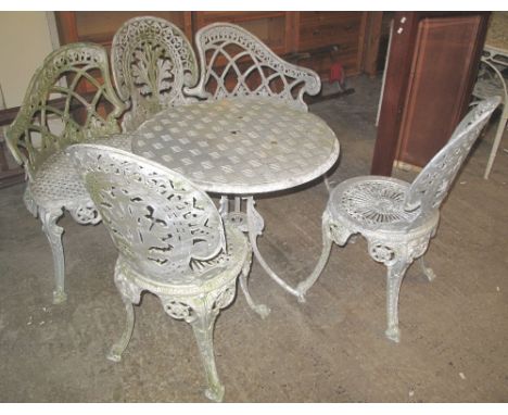 Cast aluminium garden table with tread plate top, together with a pair of Classical style cast aluminium garden chairs and a 