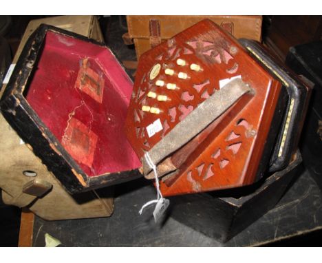 Lachenal and Company patent concertina, having mahogany pierced end panels and ivory buttons, in original fitted case. (B.P. 