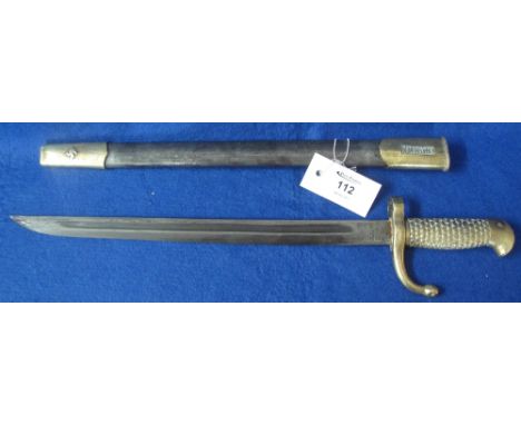 German sword bayonet, the fullered single edged blade marked: Berlin, having eagle shaped brass, scale decorated handle and b