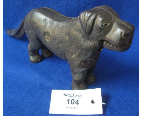 Heavy cast metal nut cracker in the form of a standing dog.(B.P. 24% incl. VAT)