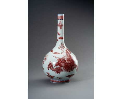 A COPPER-RED 'DRAGON' PORCELAIN BOTTLE VASE, 1900sChina, late Qing dynasty (1644-1912) - Republic period (1912-1949). The com