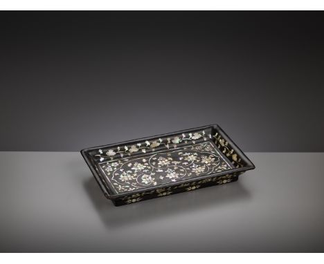 A MOTHER-OF-PEARL-INLAID BLACK LACQUER RECTANGULAR TRAY, JOSEON DYNASTYKorea, 16th-17th century. With a wide flaring rim, sup