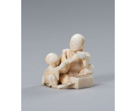 A MINIATURE IVORY OKIMONO OF FATHER AND CHILDJapan, Meiji period (1868-1912)The charming ivory okimono depicting a father and