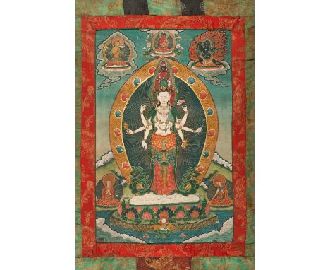 A THANGKA OF EKADASHAMUKHA AVALOKITESHVARATibet, c. 1900s. Distemper on cloth. Depicting the bodhisattva with eleven heads an