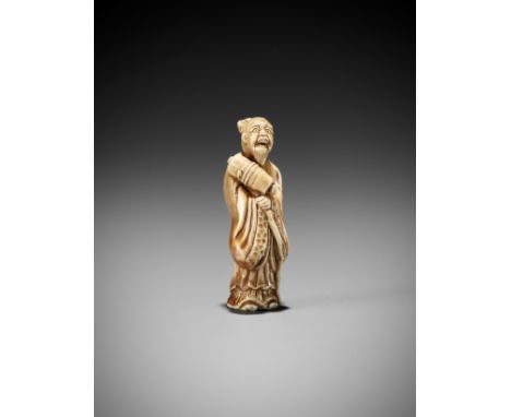A RARE GLAZED CERAMIC (YAKIMONO) NETSUKE OF A SAGEJapan, 19th centuryFinely modeled, dressed in long robes and holding a staf
