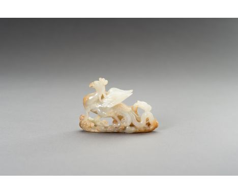 A PALE CELADON AND RUSSET JADE 'PHOENIX' CARVING, 1900sChina, late Qing dynasty (1644-1912) to Republic period (1912-1949). C