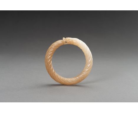 A MOTTLED WHITE AND OCHRE 'TWISTED ROPE' JADE BANGLE, 1900sChina, late Qing dynasty (1644-1912) to Republic period (1912-1949