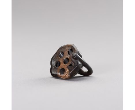 A LACQUERED WOOD NETSUKE OF A LOTUS PODJapan, 19th century, Meiji period (1868-1912)The lacquered wood netsuke, finely carved