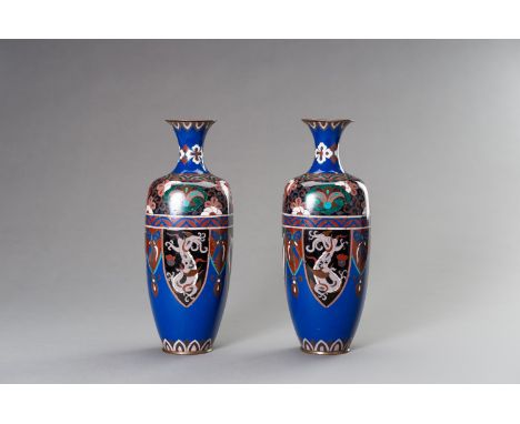 A LARGE PAIR OF CLOISONNE ENAMEL VASES, MEIJI PERIODJapan, 1868-1912. The vases of baluster shape with trumpet necks, the ext