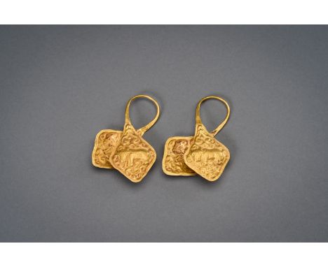 A PAIR OF CHAM GOLD 'MARANGGA' EARRINGSCham kingdom, circa 10th century. The gold double-axe shaped earrings decorated with n