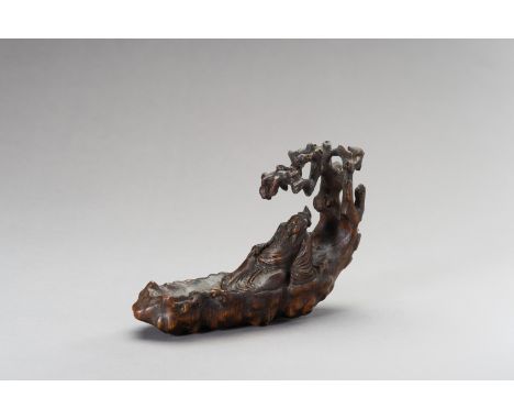 A CHENGXIANGMU ALOESWOOD CARVING OF A SAGE ON A RAFT, QING DYNASTYChina, 1644-1912. Of light, fragrant chengxiangmu (aloeswoo