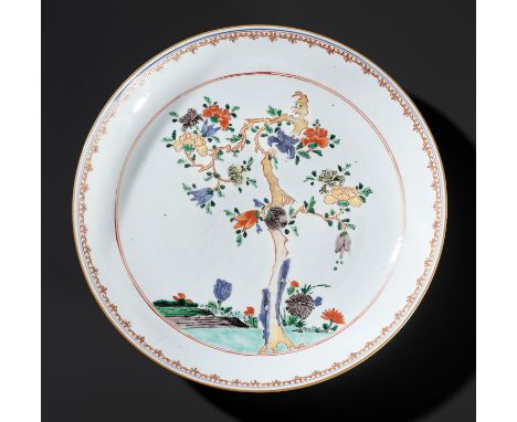 AN ENAMELLED 'BLOSSOM TREE' DISH, 18TH CENTURYChina. Painted in emerald green, apple green, aubergine, blue, and lemon yellow