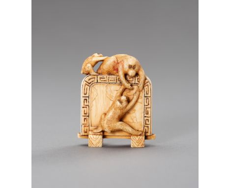 AN IVORY NETSUKE DEPICTING THREE MONKEYS CLIMBING ON A SCREENJapan, Meiji period (1868-1912)The finely carved ivory netsuke d