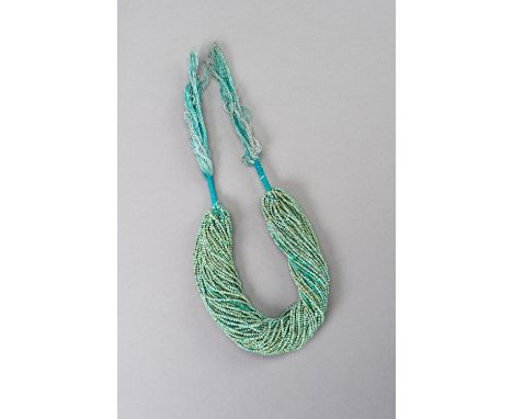 AN ANCIENT BACTRIAN TURQUOISE BEAD NECKLACEAncient region of Bactria, presumably c. 2000 years old. Composed of miniature tur