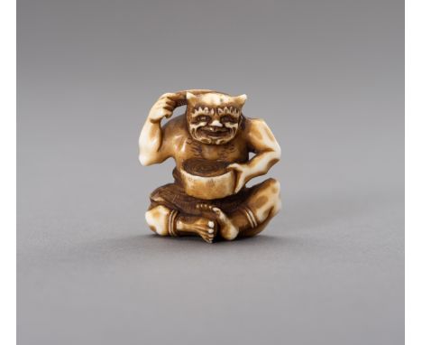 AN IVORY NETSUKE OF AN ONI COMBING HIS HAIRJapan, Meiji period (1868-1912)The finely carved and stained ivory netsuke depicti