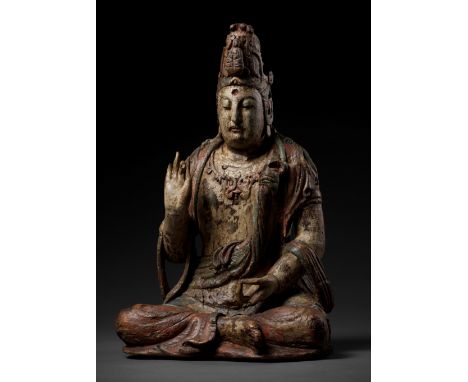 A POLYCHROME-PAINTED WOOD FIGURE OF GUANYIN, MING DYNASTYChina, 1368-1644. Seated in dhyanasana, her right hand in varada mud