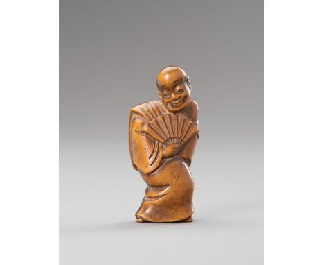A WOOD NETSUKE OF AN ACTOR WITH FANJapan, 19th centuryThe wood netsuke depicting an actor standing in an expressive pose with