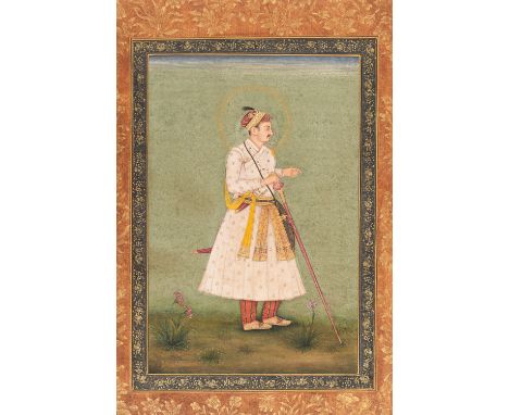AN INDIAN MINIATURE PAINTING OF A MAHARAJAIndia, Rajasthan, 19th century. Gouache and gold color on paper. Standing in an ope