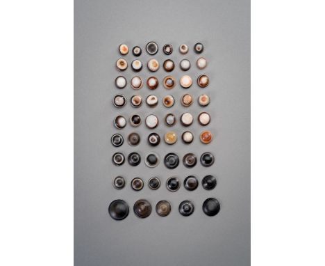 A GROUP OF FIFTY-THREE BUDDHA EYE BEADSTibet, 19th - 20th century. Consisting of fifty-three beads, twenty of larger flatter 