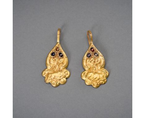 A PAIR OF CHAM GOLD REPOUSSE 'NANDI' EARRINGSCham kingdom, 10th to 12th century. Depicting Nandi surrounded by tendrils, the 
