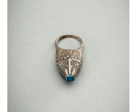 A TURQUOISE-MATRIX-SET SILVER RING, 19TH CENTURYIndia / Persia, 19th century. The silver ring with a cone shaped bezel, surmo