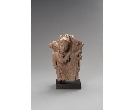 A MAJAPAHIT TERRACOTTA FRAGMENT OF A LADYJava, 13th-15th century. Modeled as a lady leaning against a trunk, the head slightl