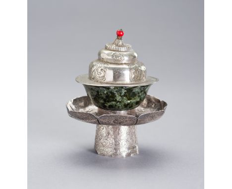 A SILVER AND JADE BUTTER TEA SETTibetan-Chinese, 19th century. Comprising a spinach green jade cup of fine translucent qualit