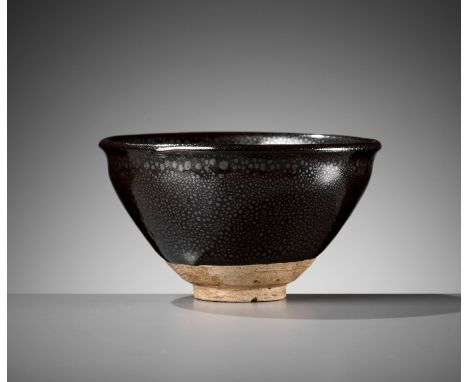 A SMALL CIZHOU-TYPE 'OIL-SPOT' BOWL, JIN DYNASTYChina, 1115-1234. The deep, rounded sides rising from a short, thick foot to 