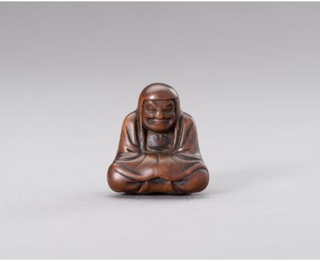 A WOOD NETSUKE OF DARUMAJapan, Edo period (1615-1868)Carved as the Zen patriarch Daruma, sitting in a meditative pose, almost