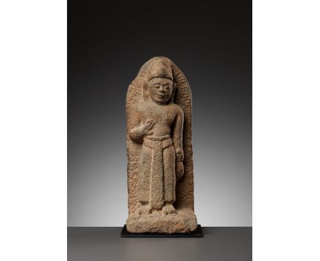 A SANDSTONE FIGURE OF A MALE DEITY, CHAM PERIODVietnam, 10th century. Boldly carved standing in samabhanga with the left hand