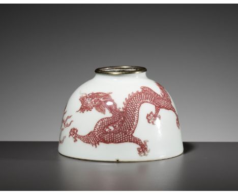 A COPPER-RED DECORATED 'DRAGON' WATERPOT, TAIBAI ZUN, QING DYNASTYChina, 1644-1912. Neatly potted with the rounded sides supp