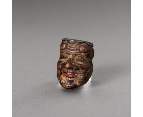 A HINOKI WOOD SAISHIKI MASK NETSUKE OF OKINASigned  Japan, Edo period (1615-1868)Carved from hinoki (cypress) wood, this sais