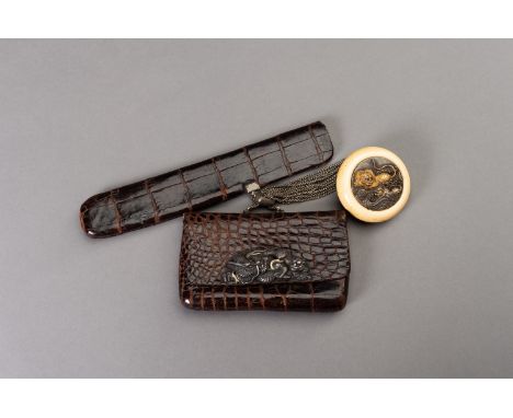 A LEATHER TABAKO-IRE (TOBACCO POUCH) AND ENSEMBLE WITH SILVER-FITTED KAGAMIBUTA NETSUKE DEPICTING A TIGER AND YOUNGUnsigned J