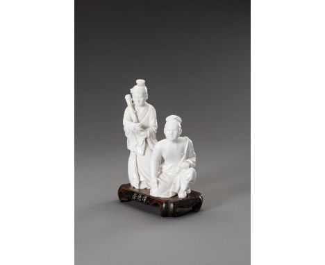 A DEHUA PORCELAIN FIGURINE OF YUE FEI, REPUBLIC PERIODChina, 1912-1949. Consisting of two dehua porcelain figurines, depictin