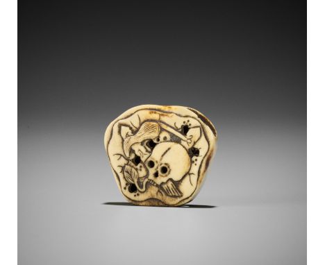 A STAG ANTLER NETSUKE WITH SKULL AND LOTUSUnsigned Japan, early 19th century, Edo period (1615-1868)The manju-style netsuke c