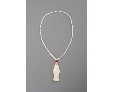 A STONE NECKLACE WITH A 'FISH' JADE PENDANTChina, 20th century or earlier. The necklace made of small, calcified stone discs 