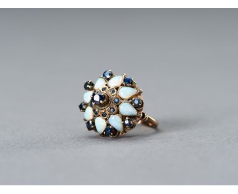 AN OPAL-SET OTTOMAN STYLE GOLD RINGIn the style of Ottoman Empire jewelry, Europe, 1900s. The ring set with eight opals, and 